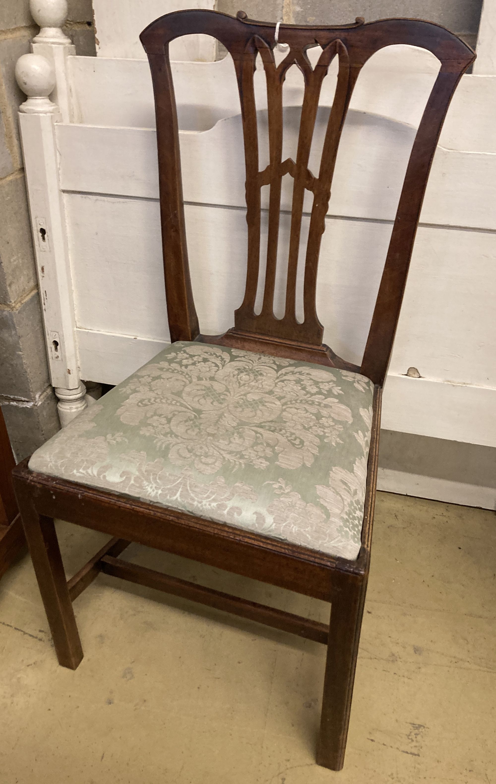 A 19th century Chippendale design mahogany dining chair, with pierced splat back over a drop in set and square underframe